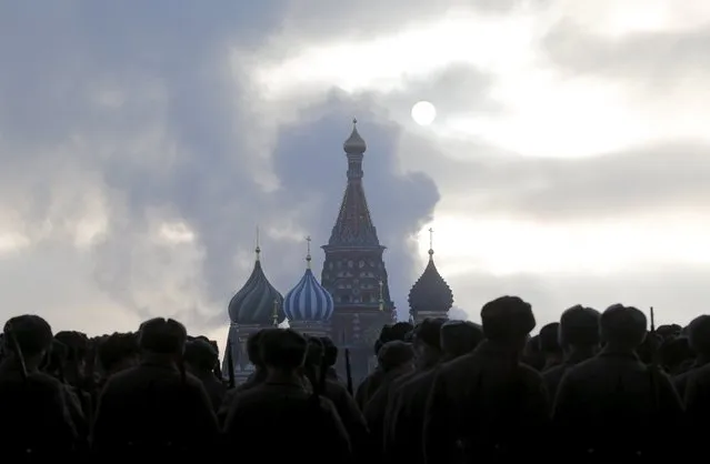Russian servicemen dressed in historical uniforms take part in a military parade on the Red Square with St. Basil's Cathedral seen in the background in central Moscow, Russia, November 7, 2015. The parade marks the anniversary of a historical parade in 1941 when Soviet soldiers marched through Red Square towards the front lines during World War Two. (Photo by Maxim Shemetov/Reuters)