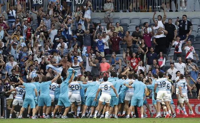 Argentina players wave to their supporters as they celebrate after the Tri-Nations rugby test between Argentina and New Zealand at Bankwest Stadium, Sydney, Australia, Saturday, November14, 2020. Argentina defeated the All Blacks 25-15. (Photo by Rick Rycroft/AP Photo)