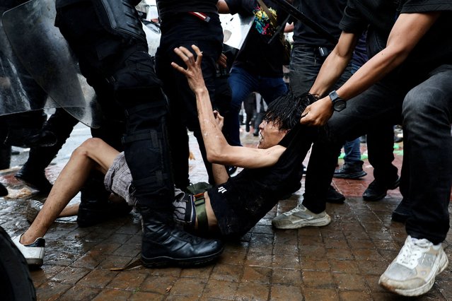 Riot police detain a man during a clash at a protest outside Indonesian parliament buildings, in Jakarta, Indonesia, on August 28, 2025. (Photo by Willy Kurniawan/Reuters)