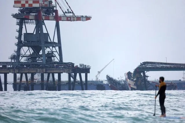 A view shows a crane that collapsed into the sea leaving one person injured and two others missing, according to Israeli police, near Ashkelon, Israel on March 14, 2023. (Photo by Amir Cohen/Reuters)