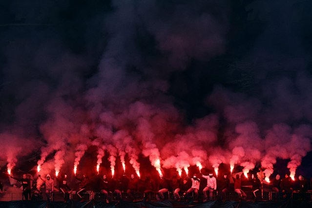 Eintracht Frankfurt fans with flares inside the stadium before the match Eintracht Frankfurt v Atalanta at Deutsche Bank Park in Frankfurt, Germany on November 26, 2025. (Photo by Kai Pfaffenbach/Reuters)