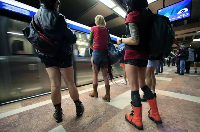 Passengers without pants wait for the subway train during “The No Pants Subway Ride” in Bucharest January 11, 2015. The event, the first organized in Romania, is an annual flash mob and occurs in different cities around the world, according to its organisers. (Photo by Radu Sigheti/Reuters)