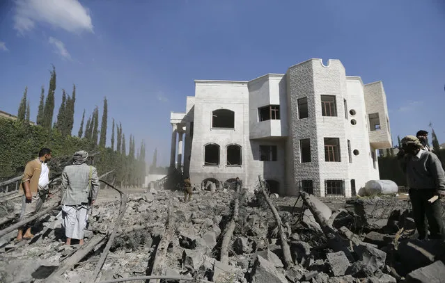 Burnt-out trees lie in the yard of a house near the residence of the Iranian ambassador after a bomb attack in Sanaa December 3, 2014. (Photo by Khaled Abdullah/Reuters)