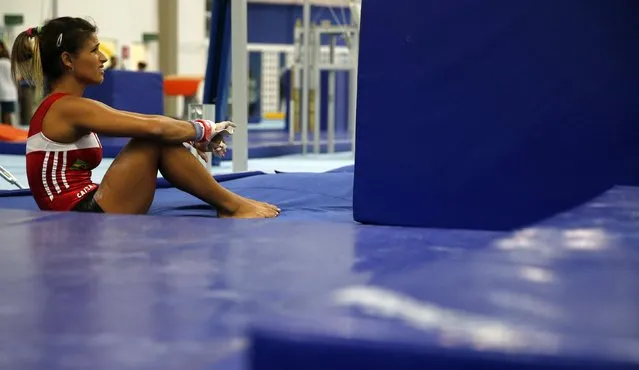 Brazilian gymnast Jade Barbosa takes a break during a training session at the new Brazilian Artistic Gymnastics Center in Rio de Janeiro January 16, 2015. (Photo by Sergio Moraes/Reuters)