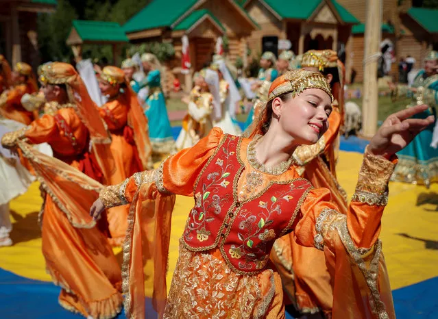 Artists perform at the Sabantuy, a summer festival marking the end of spring crop planting, in Kazan, Russia June 23, 2018. (Photo by John Sibley/Reuters)