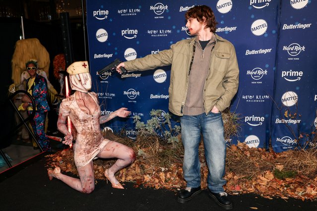 YouTuber Noor Dabash and Internet personality Bryce Mckenzie pose after arriving to Heidi Klum's 23rd annual Halloween party on Thursday, October 31, 2024, at Hard Rock Hotel New York in New York. (Photo by Caitlin Ochs/Reuters)