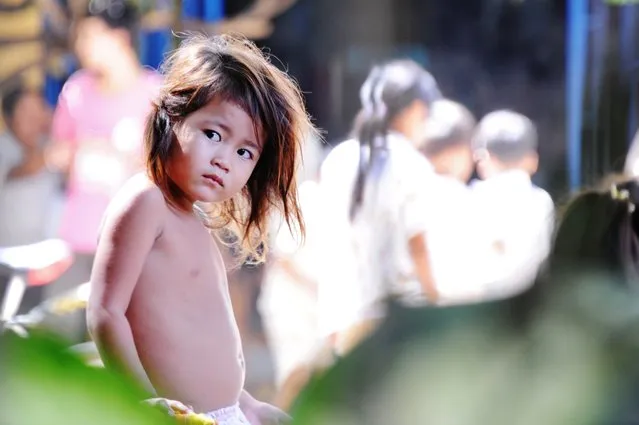 “Girl's gaze”. I captured this photo in Phnom Penh, Cambodia in October 2011. I am intrigued by the intensity of this little girl's gaze. (Photo and caption by Sandra Tavares/National Geographic Traveler Photo Contest)