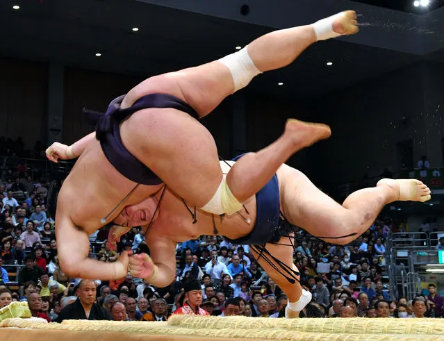 Ikioi (R) throws Myogiryu (L) to win during day one of the Grand Sumo Kyushu Tournament at Fukuoka Convention Center on November 13, 2016 in Fukuoka, Japan. (Photo by The Asahi Shimbun via Getty Images)