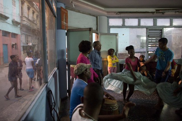 People rehearse a contemporary Haitian dance in a communal center in downtown Havana, January 30, 2015. (Photo by Alexandre Meneghini/Reuters)