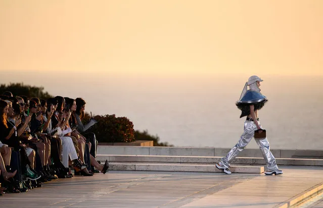 A model walks the runway for Louis Vuitton's Cruise 2023 Fashion Show at the Salk Institute in San Diego, California on May 12, 2022. (Photo by Patrick T. Fallon/AFP Photo)
