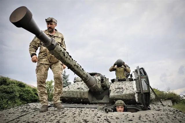 Ukrainian soldiers on a Swedish CV90 infantry fighting vehicle at their positions near Bakhmut, Donetsk region, Ukraine, Sunday, June 25, 2023. (Photo by Roman Chop via AP Photo)
