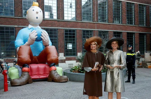 Dutch Queen Maxima and Belgian Queen Mathilde pose next to a figure of comic character Tintin as they leave the Flemish Culture House in Amsterdam during an official state visit to the Netherlands, November 28, 2016. (Photo by Francois Lenoir/Reuters)