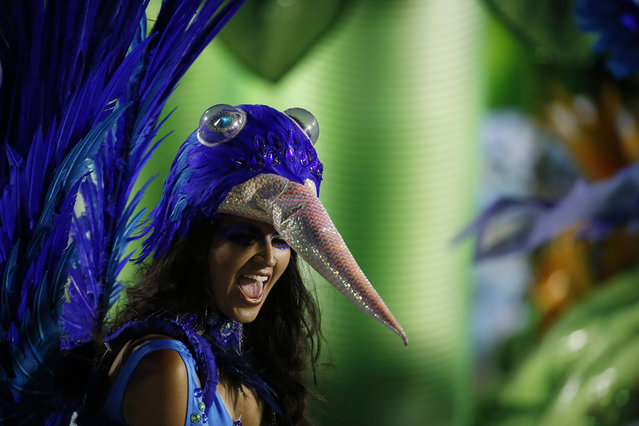 A performer from the Portela samba school parades during Carnival celebrations at the Sambadrome in Rio de Janeiro, Brazil, Monday, February 16, 2015. (Photo by Leo Correa/AP Photo)