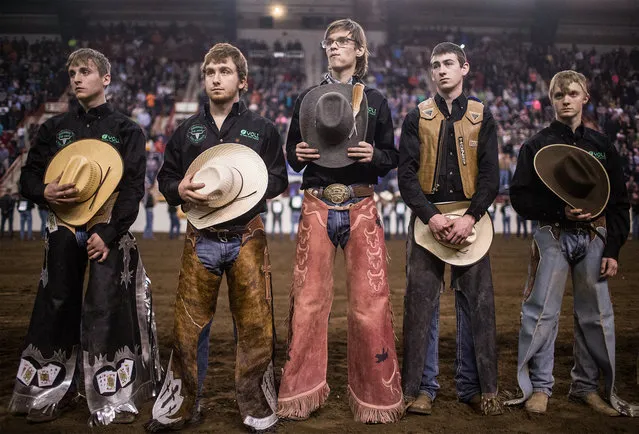 Rodeo participants stand at attention during introductions prior to the event during the first day of the 100th Pa. State Farm Show Saturday, January 9, 2016, in Harrisburg, Pa. The Farm show runs through Saturday, Jan. 16. (Photo by Sean Simmers/PennLive.com via AP Photo)