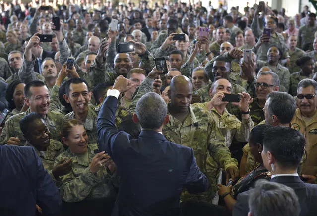 US President Barack Obama greets service members after speaking on counterterrorism at MacDill Air Force Base in Tampa, Florida on December 6, 2016. (Photo by Mandel Ngan/AFP Photo)