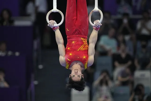 Zhang Boheng of China performs on the rings at the men's all-around individuals gymnastics event of the 19th Asian Games in Hangzhou, China, Tuesday, September 26, 2023. Kitazono won bronze medal. (Photo by Aaron Favila/AP Photo)