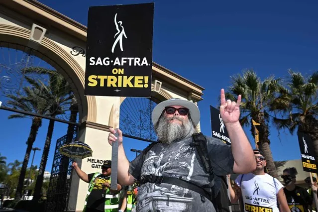 US actor Jack Black joins SAG-AFTRA members and supporters as they picket outside Paramount Studios during their strike against the Hollywood studios, in Los Angeles, California, on November 8, 2023. (Photo by Robyn Beck/AFP Photo)