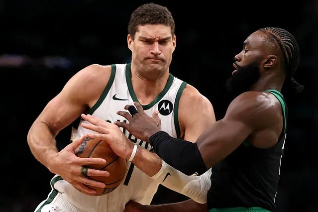 Jaylen Brown #7 of the Boston Celtics defends Brook Lopez #11 of the Milwaukee Bucks during the second quarter at TD Garden on November 22, 2023 in Boston, Massachusetts. (Photo by Maddie Meyer/Getty Images)