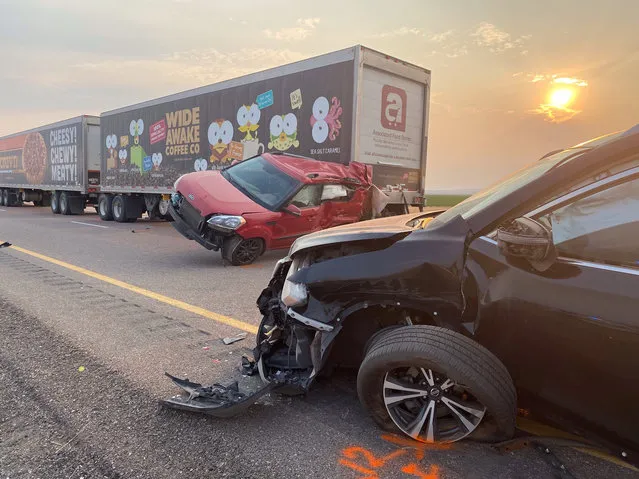 This photo provided by the Utah Highway Patrol and posted on the Utah Department of Public Safety website shows several of the vehicles involved in a fatal pileup, Sunday, July 25, 2021, on Interstate 15 in Millard County, near the town of Kanosh, Utah. (Photo by Utah Highway Patrol via AP Photo)