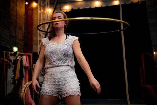 Writer and performer Olga Kaleta rehearses a hula-hoop routine in a Bristol studio on September 28, 2021, as she prepares for her show “Period Drama”, which is an experimental show about anxiety disorder, periods, slasher flicks and the perils of everyday life, with fully integrated British Sign Language interpretation by Sherrie Eugene-Hart. (Photo by Ben Birchall/PA Images via Getty Images)