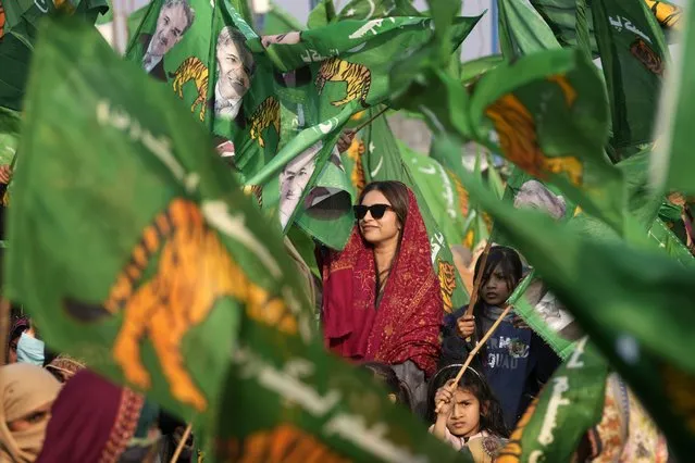 Supporters of Pakistan's former Prime Minister Nawaz Sharif's party listen to Sharif's speech during an election campaign rally in Khudian Khas near Kasur, Pakistan, Tuesday, February 6, 2024. (Photo by K.M. Chaudary/AP Photo)
