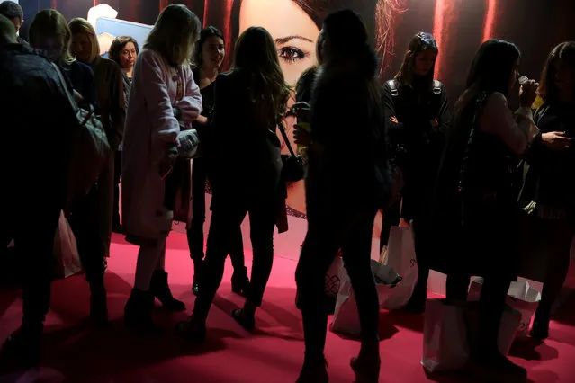 People wait to attend the Jesus Lorenzo's Fall/Winter 2017 show during the Mercedes-Benz Fashion Week in Madrid, Spain February 20, 2017. (Photo by Susana Vera/Reuters)