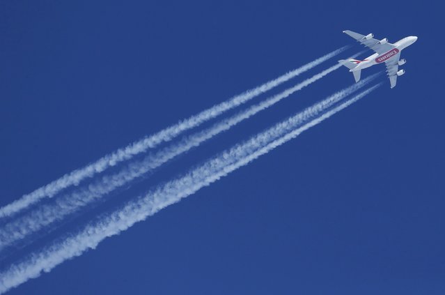 An Emirates Airbus A380-861 on its way from Dubai to London flies over St. Moritz, Switzerland, February 13, 2017. (Photo by Ruben Sprich/Reuters)