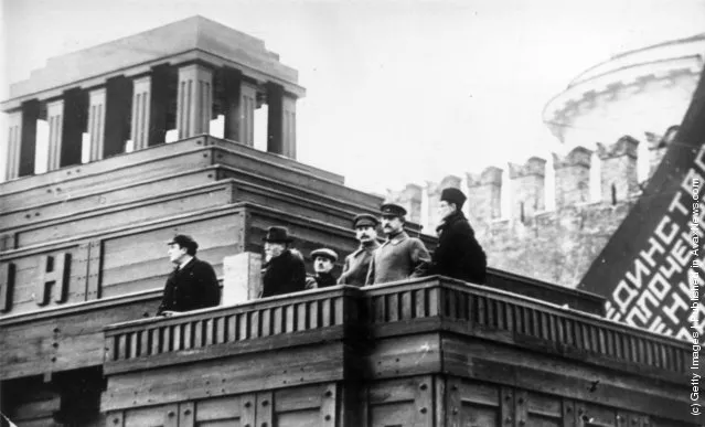 1926: Joseph Stalin, leader of the Russian Communist party and his colleagues, Felix Kon, Valerian Kuybyshev, Grigory Ordzhonikidze and Mikhail Kalinin, president of the USSR, address the crowds from atop the Lenin Mausoleum in Moscow's Red Square