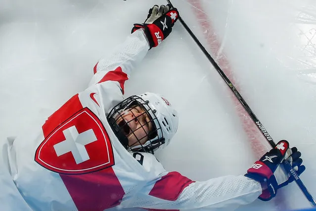 Alina Muller of Switzerland celebrates after scoring during the Women's Ice Hockey Play-offs Quarterfinals match between the Russian Olympic Committee and Switzerland at the Beijing 2022 Olympic Games, Beijing, China, 12 February 2022. (Photo by Mark Cristino/EPA/EFE)