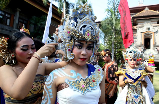 Women dancers in costumes prepare before a parade at the opening of the Bali arts festival in Denpasar, Bali, Indonesia on Saturday, June 15, 2024. (Photo by Firdia Lisnawati/AP Photo)