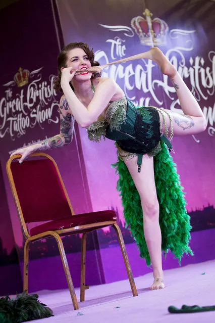 Millie Dollar performs her burlesque routine at The Great British Tattoo Show at Alexandra Palace on May 24, 2014 in London, England. (Photo by Tristan Fewings/Getty Images for Alexandra Palace)
