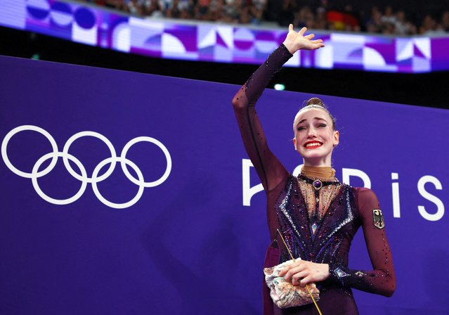 Germany's Darja Varfolomeev celebrates after winning the rhytmic gymnastics' individual all-around final during the Paris 2024 Olympic Games at the Porte de la Chapelle Arena in Paris, on August 9, 2024. (Photo by Hannah Mckay/Reuters)