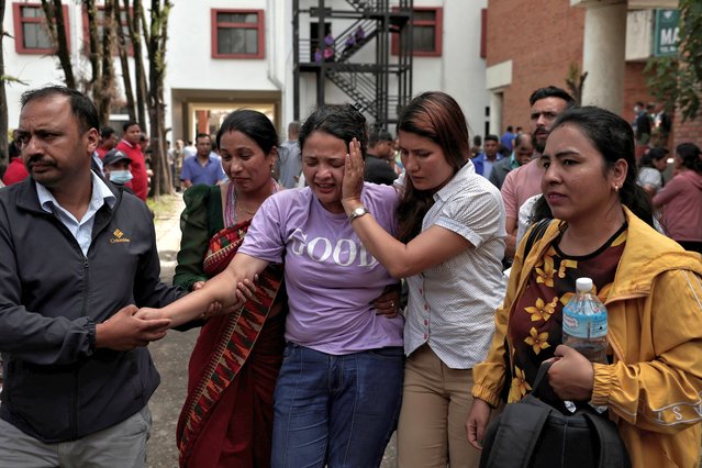 Family members of the victims weep outside a hospital after a Saurya Airlines plane caught fire after skidding off the runway while taking off at Tribhuvan International Airport, in Kathmandu, Nepal, on July 24, 2024. (Photo by Navesh Chitrakar/Reuters)