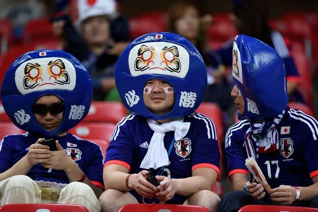 Japanese supporters wait for the start of the Group C football match between Ivory Coast and Japan at the Pernambuco Arena in Recife during the 2014 FIFA World Cup on June 14, 2014. (Photo by Toshifumi Kitamura/AFP Photo)