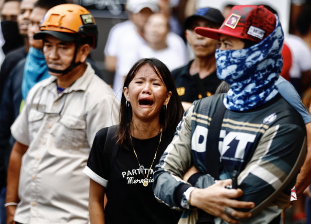 A Filipino informal settler reacts during a demolition raid at a shanty town in Pasay City, Metro Manila, Philippines, 01 August 2024. (Photo by Francis R. Malasig/EPA)