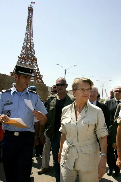 Lebanon: France's Defense Minister Michele Alliot-Marie, foreground right, walks past a replica of the Eiffel Tower during her visit at the UNIFIL headquarters in the southern Lebanese bordertown of Naqura, Monday, September 18, 2006. (Photo by Dominique Faget/AP Photo)