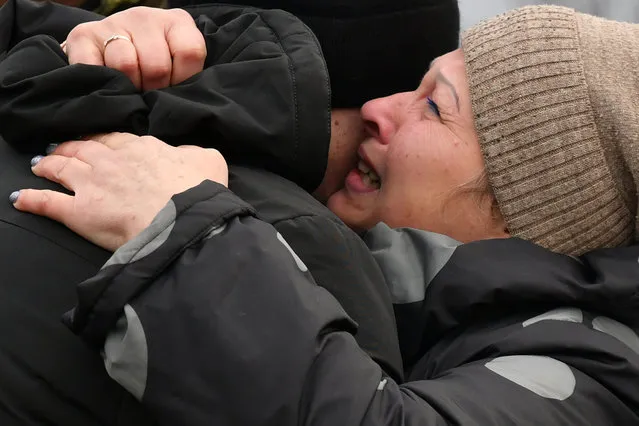 Ukrainian Ivan Katyshev - who was made prisoner - is embraced by his mother Lyudmila after being exchanged during a prisoner exchange between Ukraine and pro-Russian rebels near the Mayorsk checkpoint on December 29, 2019. (Photo by Genya Savilov/AFP Photo)