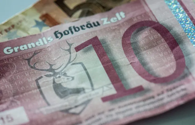 A picture made available on 17 July 2015 of a counterfeit banknote vaguely resembling a 10 euro note, which a pub owner indeed accepted, as counterfeit banknotes are presented at the German federal bank Bundesbank in Frankfurt Main, Germany, 15 July 2015.  Some 450,000 counterfeit euro banknotes were seized worldwide in the first half of 2015, acording to the European Central Bank (ECB). (Photo by Boris Roessler/EPA)