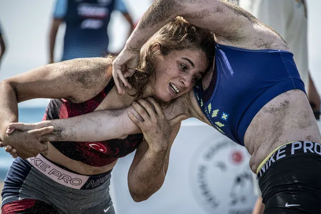 In this handout image provided by United World Wrestling, Hatice Ede Tekin (L) of Turkey competes against Yulia Kremezna Malyk of the Ukraine during the final day of the first stop of the UWW Beach Wrestling World Series on May 29, 2022 in Sarigerme, Turkey. (Photo by Dean Treml/UWW via Getty Images)