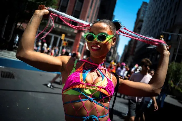 A person takes part in the 2022 NYC Pride parade in Manhattan, New York City, New York, U.S., June 26, 2022. (Photo by Athti Perawongmetha/Reuters)