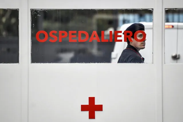 A Carabinieri (Italian paramilitary police) officer on patrol at former military hospital Baggio, which reopened a ward to hospitalize patients recovering from the COVID-19 virus, in Milan, Italy, Tuesday, March 2, 2020. The strain on Lombardy's health system has forced authorities to seek to bring doctors out of retirement, accelerate graduation dates for nursing students, and incorporate doctors and hospital beds from the private sector to ease the strain on public hospitals. (Photo by Claudio Furlan/LaPresse via AP Photo)