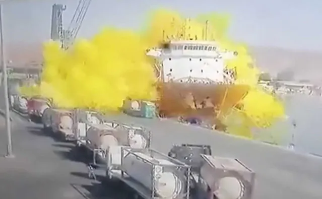 This photo taken from CCTV video broadcasted by Al-Mamlaka TV shows a chlorine gas explosion after it fell off a crane in the port of Aqaba, Jordan, Monday, June 27, 2022. Some dozen workers were killed and scores were hospitalized. (Photo by Al-Mamlaka TV via AP Photo)
