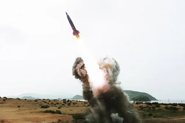 A tactical rocket is launched during a test fire in this undated photo released by North Korea's Korean Central News Agency (KCNA) in Pyongyang August 15, 2014. (Photo by Reuters/KCNA)