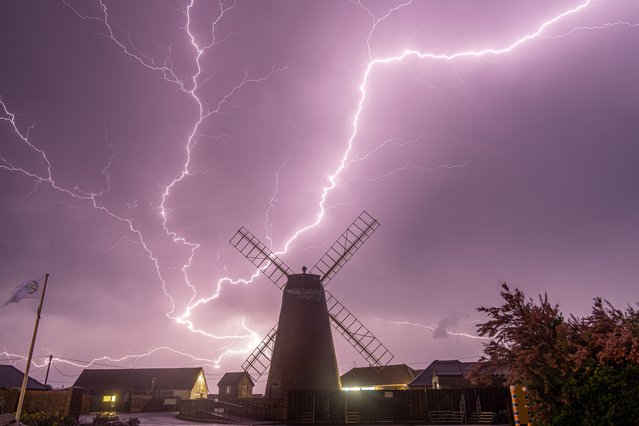 The lighting over Medmerry Mill in Selsey, West Sussex, United Kingdom on Thursday,  June 16, 2022 evening as the area was hit with thunderstorms during last nights unsettled weather. (Photo by Coastal J.J./Bav Media)