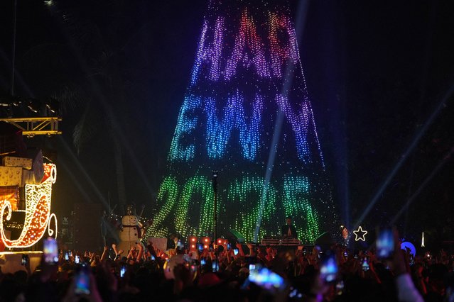 People attend New Year’s Eve celebrations in Mumbai, India, on December 31, 2024. (Photo by Hemanshi Kamani/Reuters)