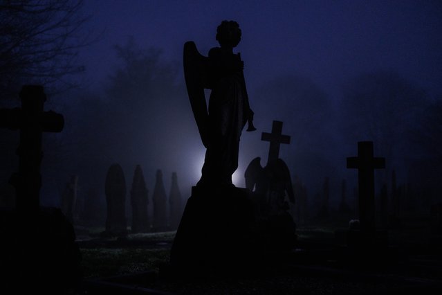 Graves are silhouetted in a foggy graveyard on December 27, 2024 in Goole, United Kingdom. Dense fog has caused travel disruption across the UK. (Photo by Dan Kitwood/Getty Images)