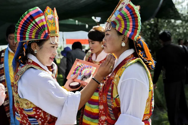 Performers apply makeup in preparation for the Cultural Festival of the Tibetan Opera in Lhasa, Tibet on August 3, 2016. (Photo by Xinhua/Barcroft Images)
