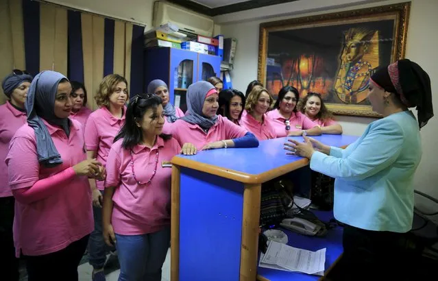 Reem Fawzy (R), the director of the Pink Taxi company, speaks with her team of women drivers at her office in Cairo, Egypt, September 6, 2015. (Photo by Amr Abdallah Dalsh/Reuters)