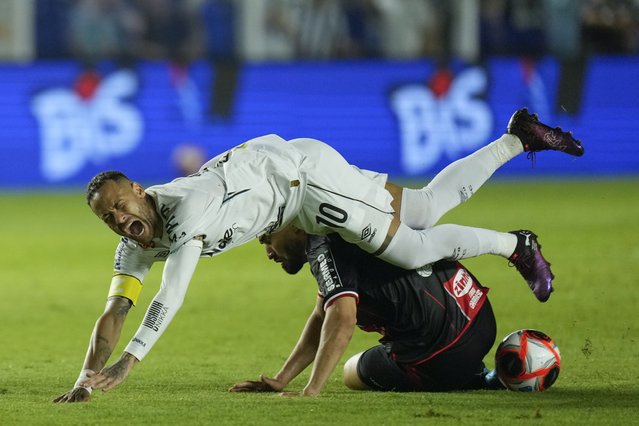 Brazil's Neymar is fouled by Botafogo-SP's Alisson Cassiano during his debut match for Santos FC, in a Sao Paulo league soccer match, in Santos, Brazil, Wednesday, February 5, 2025. (Photo by Andre Penner/AP Photo)
