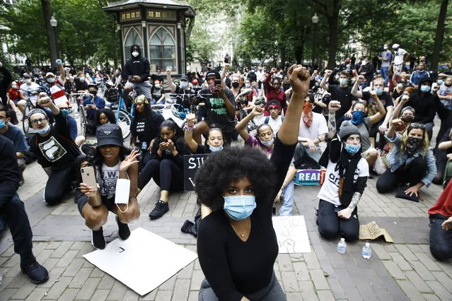 Demonstrators chant Tuesday, June 2, 2020, at Rittenhouse Square in Philadelphia, during a protest over the death of George Floyd, who died May 25 after he was restrained by Minneapolis police. (Photo by Matt Rourke/AP Photo)